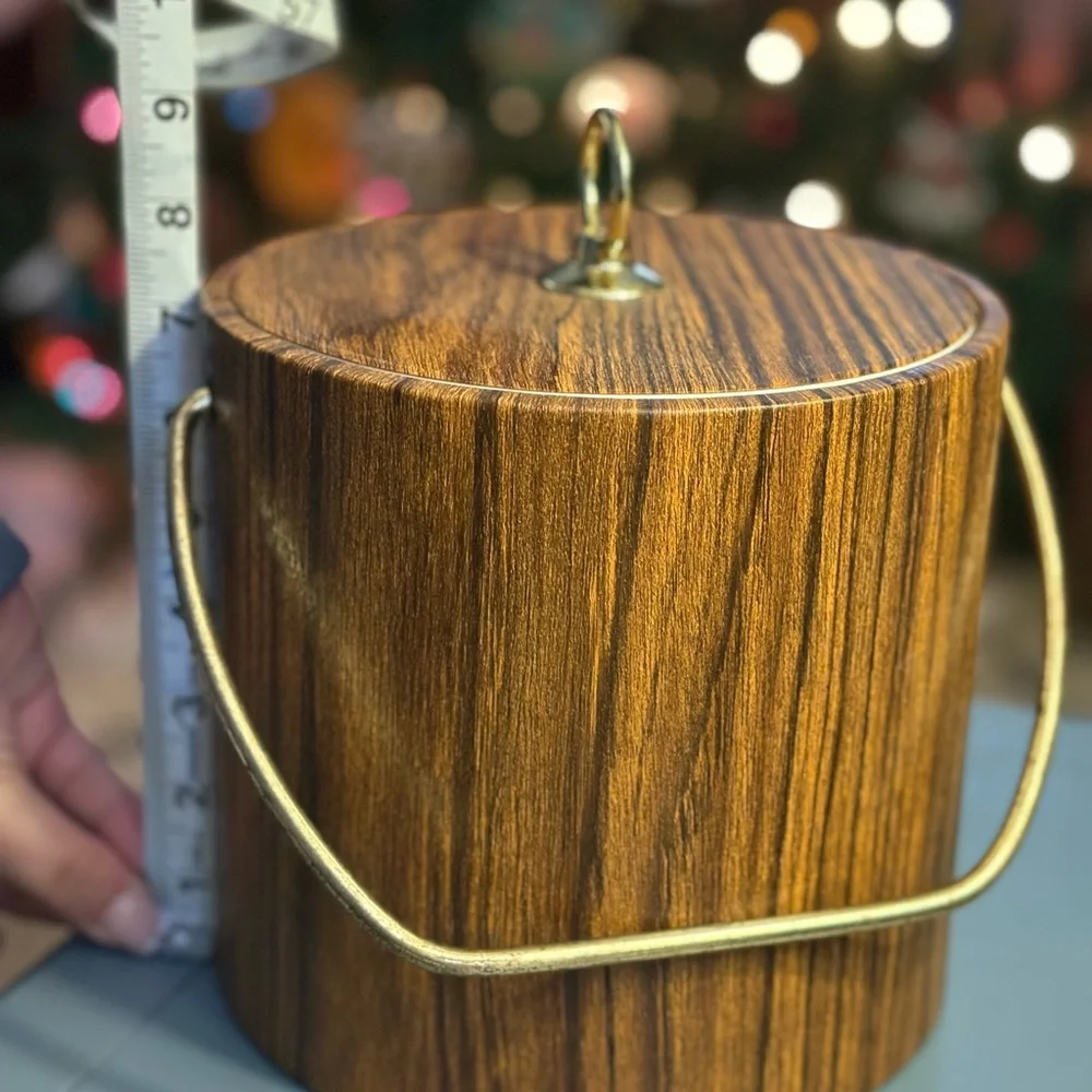 Vintage faux wood ice bucket, likely produced in the 1960s or 1970s